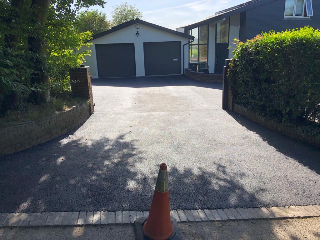 This is a photo of a bitumen driveway which is in the process of being installed by Mulgrave Road Tech